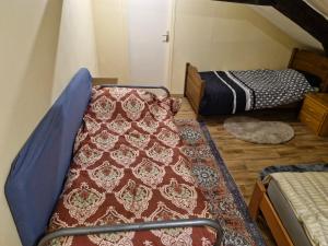 a room with two bunk beds and a rug at Carthage in Vierzon +2 photos
