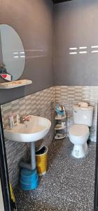 a bathroom with a sink and a toilet at ST house in Ban Nua Khlong