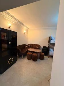 a living room with a couch and a table at Aya House in Casablanca