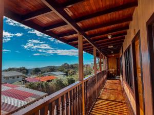 a balcony of a house with a view at Hotel El Atardecer in Monteverde Costa Rica