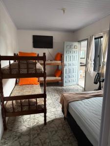 En eller flere senge i et værelse på Pousada Dona Zilma Refugio Paradisíaco 2