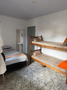 En eller flere senge i et værelse på Pousada Dona Zilma Refugio Paradisíaco 2