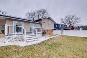 a house with a white fence in a yard at Work & Explore, Cozy Unit 5 Mi to UMD! in Lanham