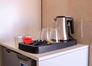 a coffee maker on top of a counter at Desert Stars Bubble Camp Wadi Rum in Wadi Rum