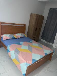 Giường trong phòng chung tại T0 Brisa Tropical