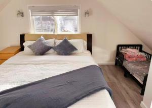a bedroom with a large bed and a window at Elmshade Villa in Vancouver South in Vancouver