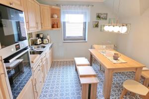 Kuchyň nebo kuchyňský kout v ubytování Seeadler am Schweriner See - ABC37 - nur Feriengäste! + 17 fotografií