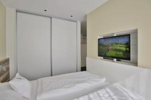 En eller flere senge i et værelse på Duhner Strandhus, S3