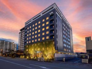 a large building with lights on the side of it at Mercure Hida Takayama in Takayama