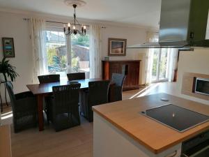a kitchen and dining room with a table and chairs at Stadthaus Lübsche Burg - ABC326 in Wismar