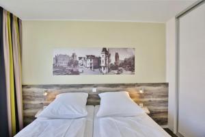 En eller flere senge i et værelse på Duhner Strandhus, S208 + 3 billeder