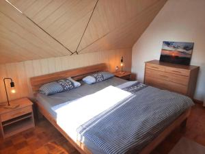 Postel nebo postele na pokoji v ubytování Romantic Retreat, Kröpelin