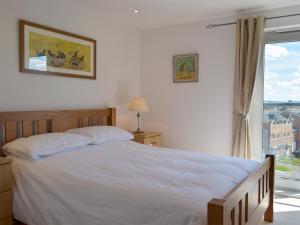 En eller flere senge i et værelse på Seaview