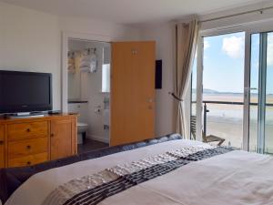 En eller flere senge i et værelse på Seaview