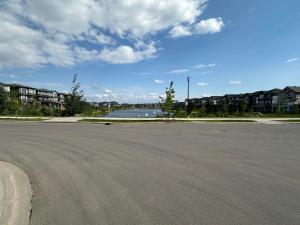 an empty parking lot next to a body of water at Sleek Guest Retreat SW EDM BSMT Suite in Edmonton
