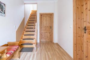 a room with wooden stairs and a door at Ferienhaus Klütz in Klütz