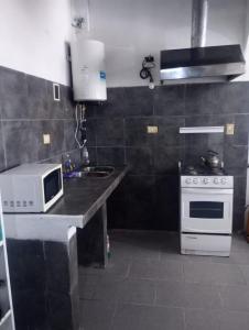 Køkken eller tekøkken på La Casa de Martu + 4 billeder