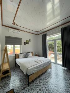 Postel nebo postele na pokoji v ubytování Tam Coc Harmony Homestay