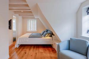 En eller flere senge i et værelse på Villa Sanskiin