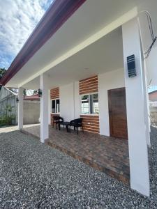 an external view of a house with a patio at Casa B Pasco in Dauin