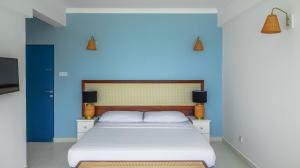 Postel nebo postele na pokoji v ubytování Mask & Tide