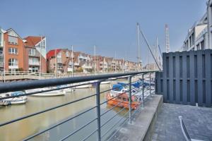 a group of boats are docked in a harbor at City Marina, CM20b in Cuxhaven