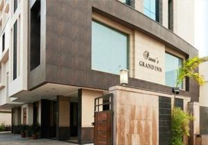 a building with a sign on the front of it at Ponnis Grand Inn in Chennai