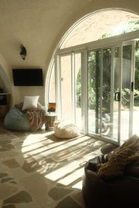 a living room with a large sliding glass door at Sunshine Coast Hinterland Igloo Retreat Romantic & Private in Flaxton