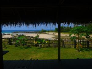 a view of a beach from a house with a view at Kita Surf Resort in Lasikin