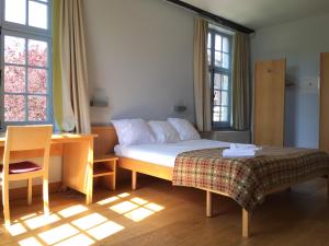 Postel nebo postele na pokoji v ubytování Irish College Leuven