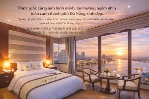 a bedroom with a bed and a view of a river at MOONLIGHT Hotel & Suites - The Best City View, Dragon Bridge view in Da Nang