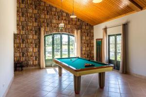 a room with a pool table in a house at Casas de São José in Rio Maior