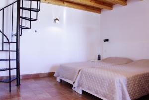 Postel nebo postele na pokoji v ubytování Casa Das Romãs