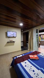 En eller flere senge i et værelse på Norvilla Rooftop Pantai Cenang + 12 billeder