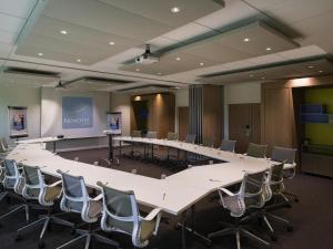 a large conference room with a large table and chairs at Novotel Roissy Saint Witz in Saint-Witz +87 photos