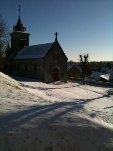 a large church with a snow covered yard with aciples at 4 Joliette in Tartiers