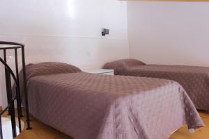 Postel nebo postele na pokoji v ubytování Casa Das Romãs