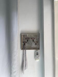 a lock on a door with the word keys on it at Baan Klang Khao Mountain Viewบ้านกลางเขา เมาเทนวิว in Nong Nam Daeng +26 photos