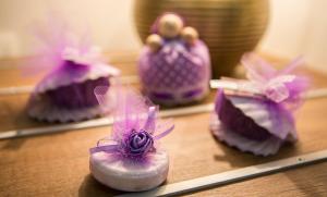 a group of little purple shoes sitting on a table at Boutique Hotel Melissa in Poreč
