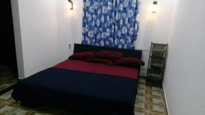 a bedroom with a bed in a room at Skyfall Villa in Chillithodu