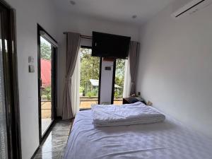 Giường trong phòng chung tại Villa Garden Grove