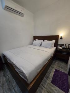 Giường trong phòng chung tại Villa Garden Grove