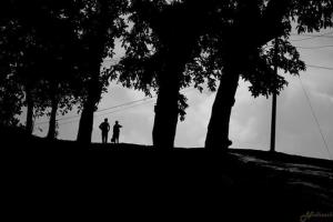 two people standing on a hill next to trees at Skyfall Villa in Chillithodu