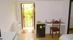 En eller flere senge i et værelse på Sucholtee Resort