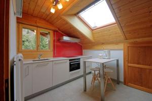 a kitchen with a sink and a table at Drelo 3 in Verbier
