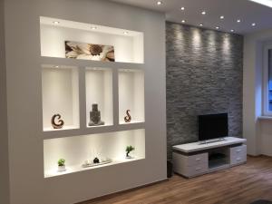 A television and/or entertainment centre at Synagogue Gozsdu Private Apartments