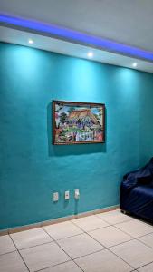 Et opholdsområde på Flat encantador com estacionamento incluído