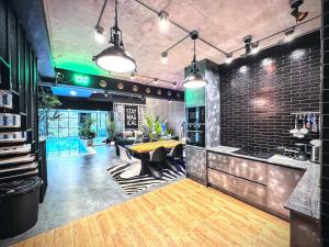 a kitchen with a table and chairs in a room at Z Loft Seaside FutureJungle Loft in Nathon Bay