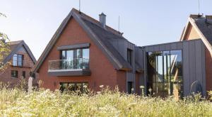 an extension to a house in the netherlands at Ferienhaus Baltic in Lobbe in Lobbe