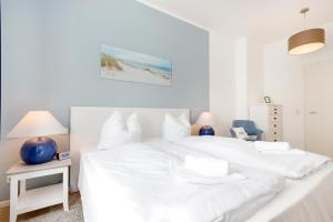 Postel nebo postele na pokoji v ubytování Villa Wiederkehr Heimkehr + 12 fotografií